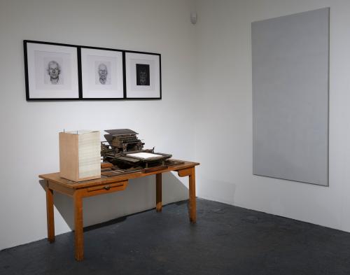 Variation on a theme of Roman Opalka, mixed media installation, i.a. wooden table, canvas, typessetting machine, paper, dimensions variable, 3x 55x55 cm, 2011